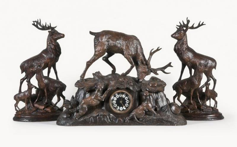 Black Forest three piece hand carved mantel clock garniture with stag