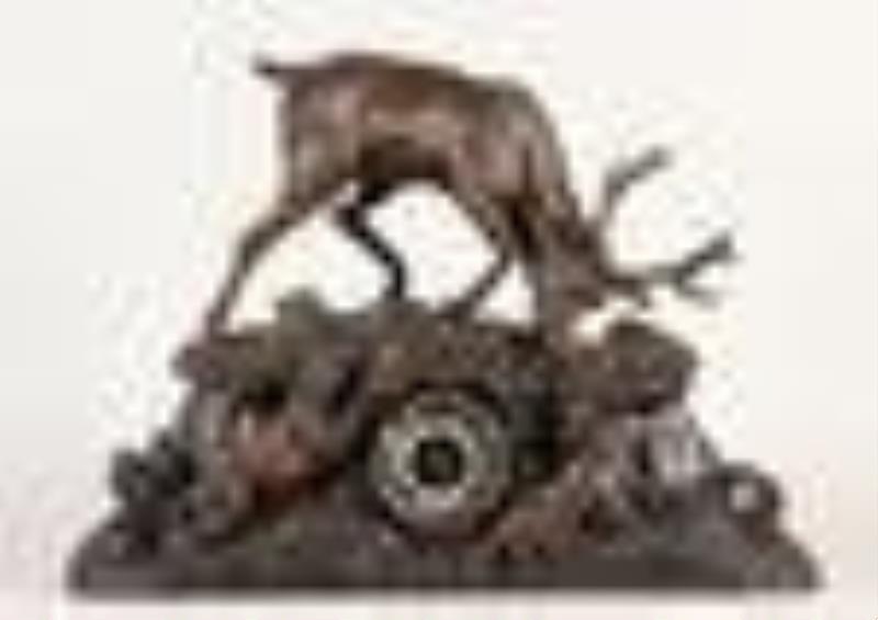 Black Forest three piece hand carved mantel clock garniture with stag