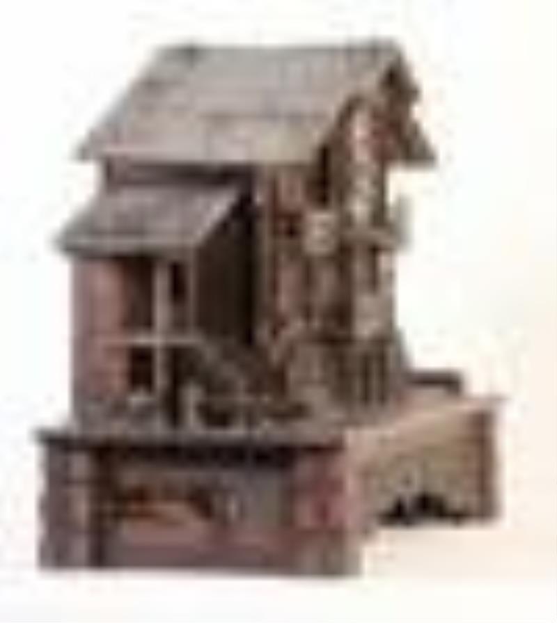 A good late 19th century Swiss carved chalet form clock with music box