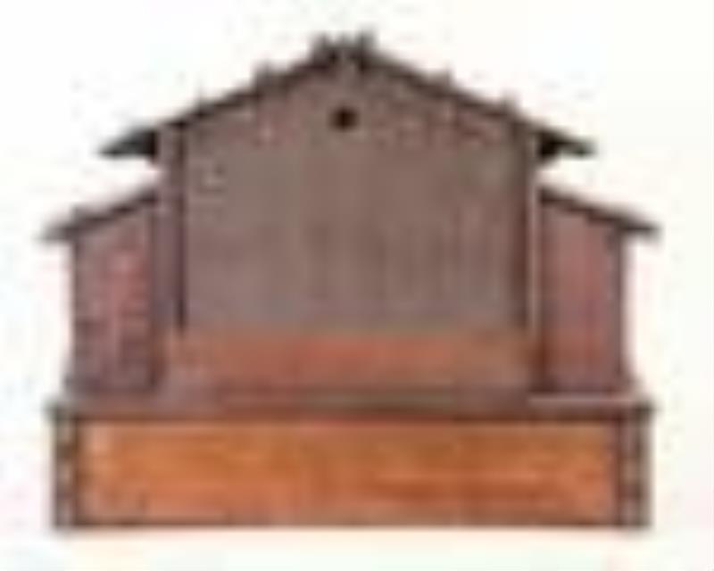 A good late 19th century Swiss carved chalet form clock with music box