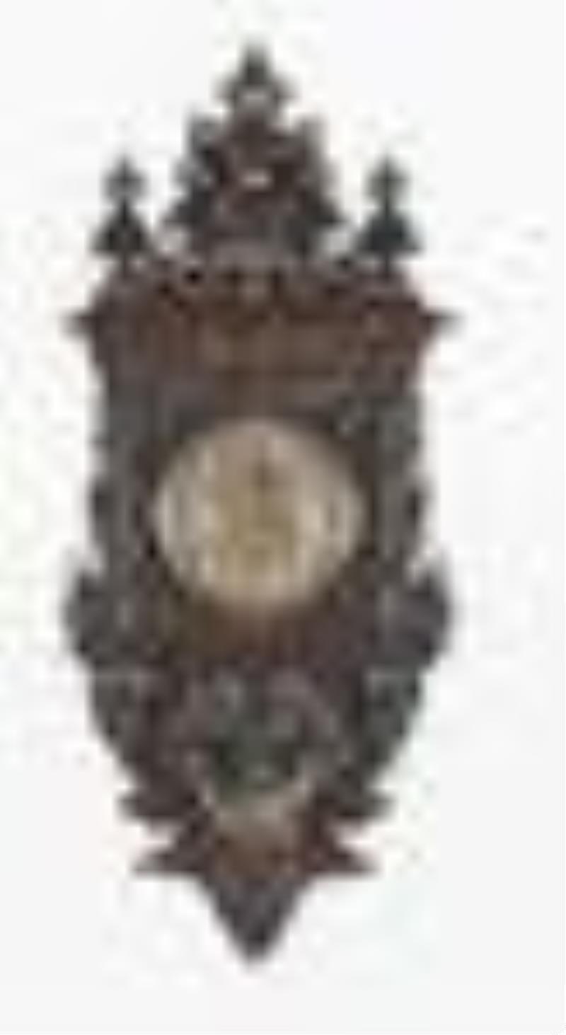 A spectacular late 19th century carved Columbian Exposition wall clock by F.X. Wildenauer