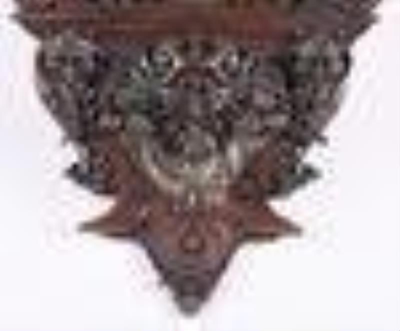 A spectacular late 19th century carved Columbian Exposition wall clock by F.X. Wildenauer