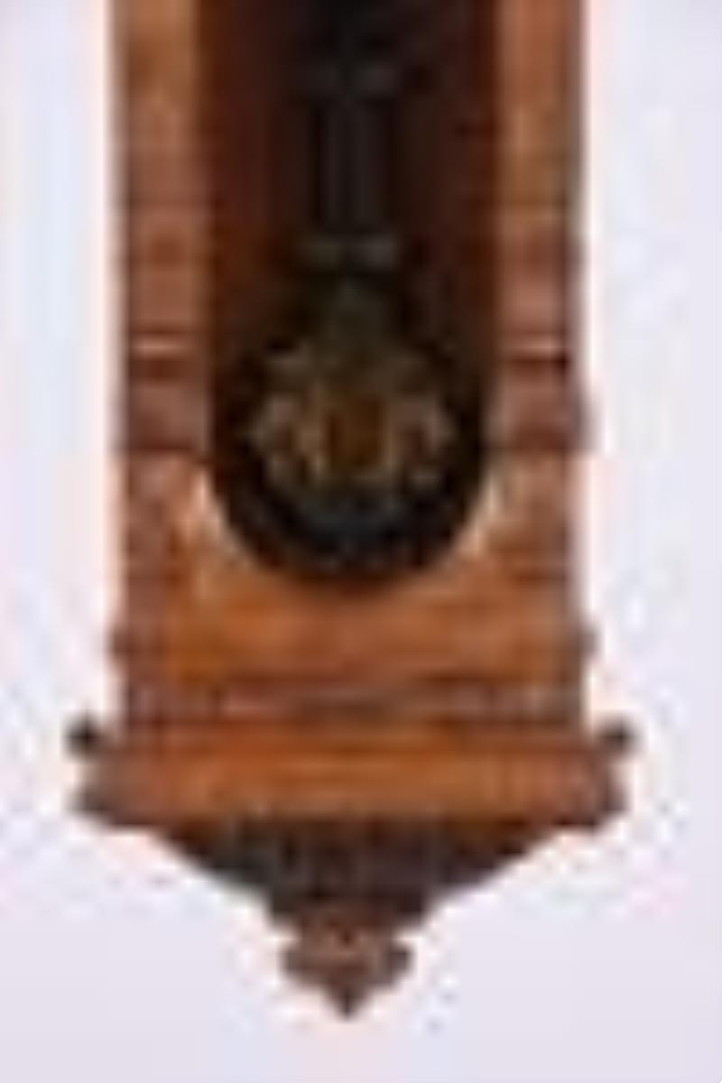 A late 19th century Vienna style patented one year clock