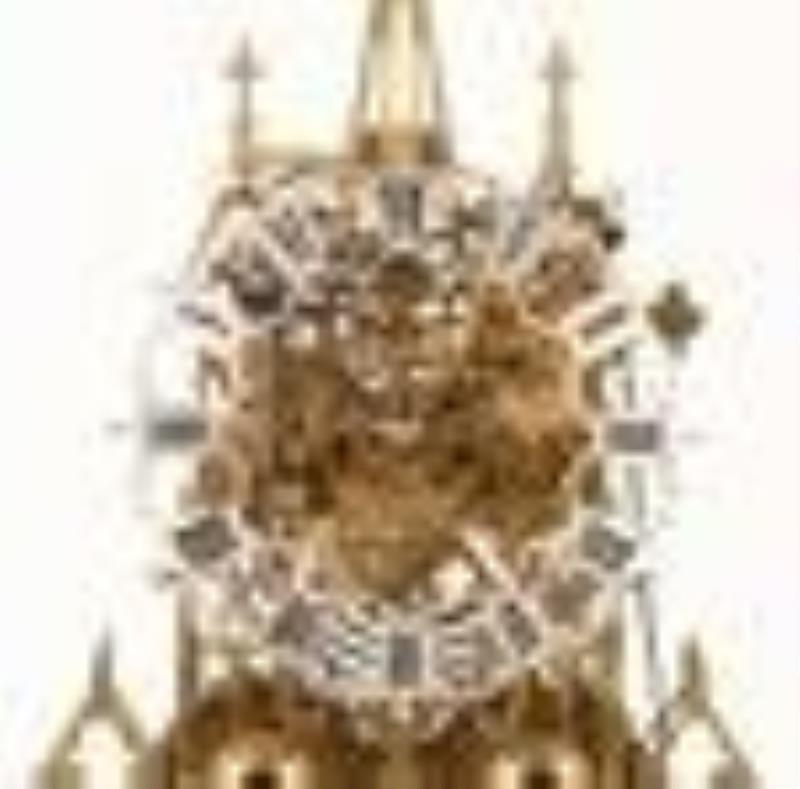 A good mid 19th century cathedral form skeleton clock attributed to Evans