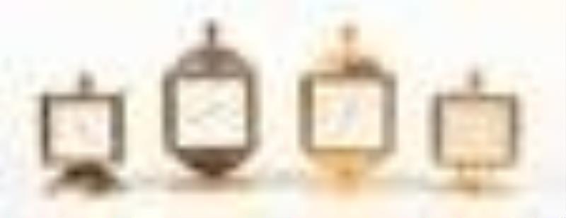 Four Swiss weather station clocks