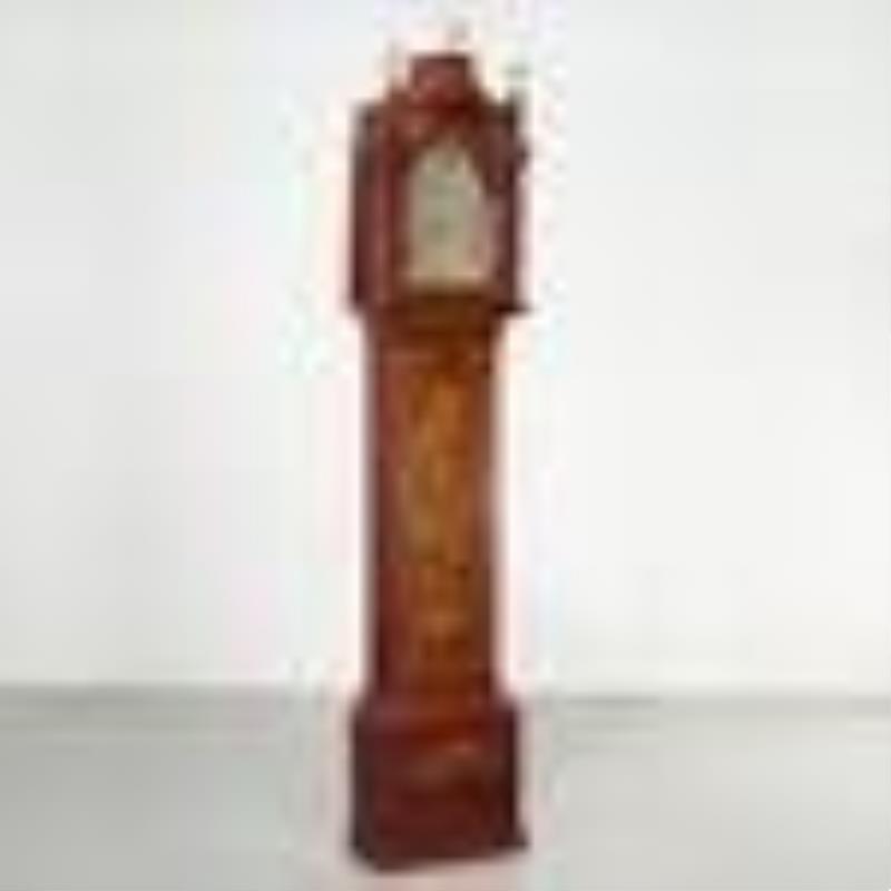 Red japanned tall clock supplied by Mario Buatta
