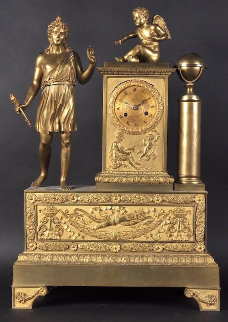 A LARGE EMPIRE ORMOLU CLOCK with circular dial and