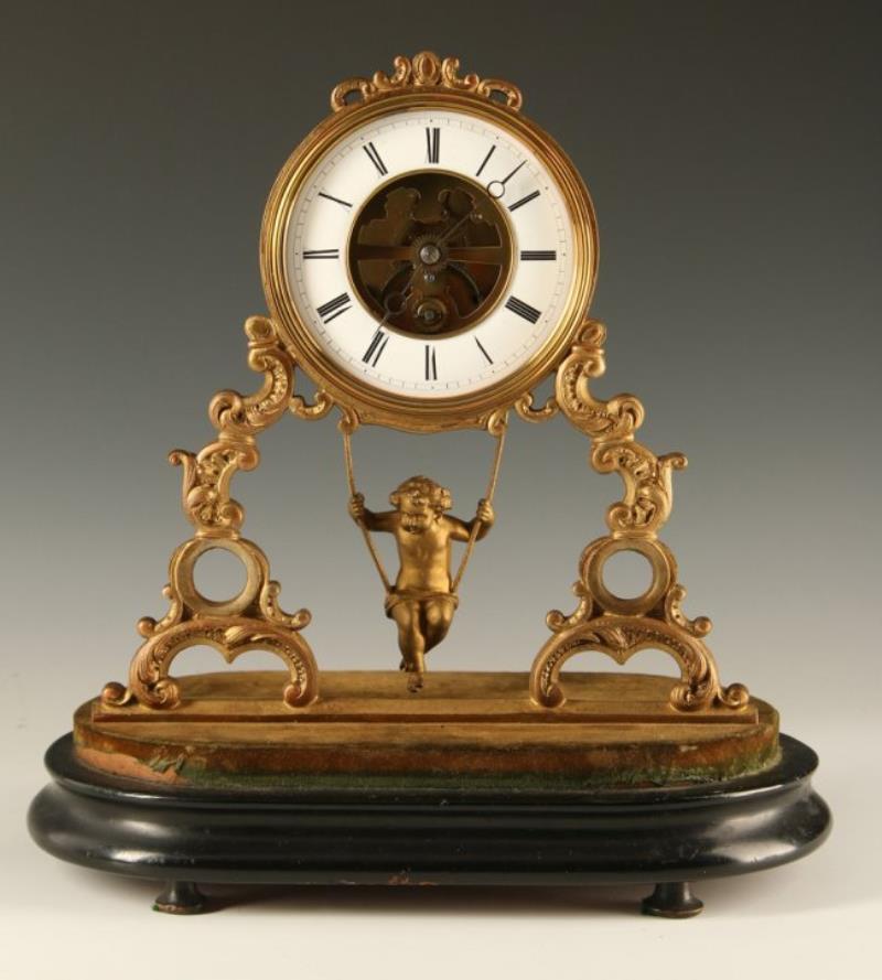 A 19TH C. FRENCH CLOCK WITH CHERUB SWING PENDULUM