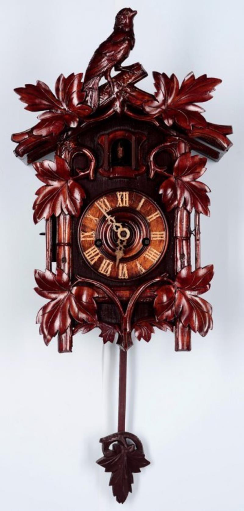 A BLACK FOREST CUCKOO AND QUAIL CLOCK SIGNED BEHA