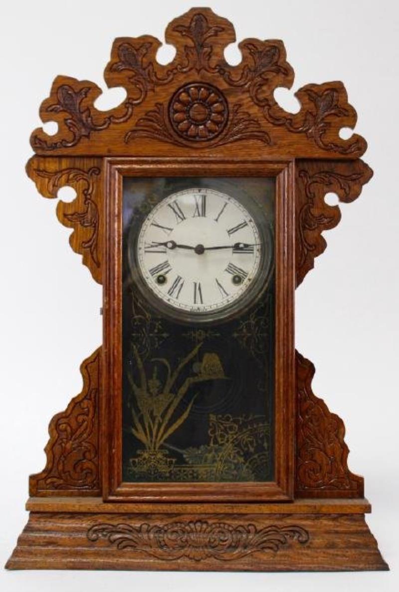 Late 19th to Early 20th century American pressed Oak case gingerbread clock