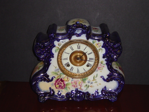 19TH C ANSONIA DRESDEN PORCELAIN 8 DAY CLOCK. CAT