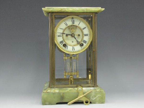 A GREEN ONYX CRYSTAL REGULATOR BY ANSONIA WITH MERCURY