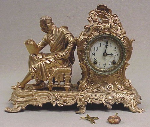 Ansonia ‘Racine’ Figural Clock-14″ Long, 11″ Tall