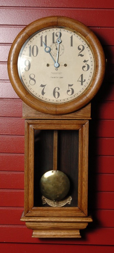 A NEW HAVEN ‘SATURN’ WALL CLOCK IN OAK CASE