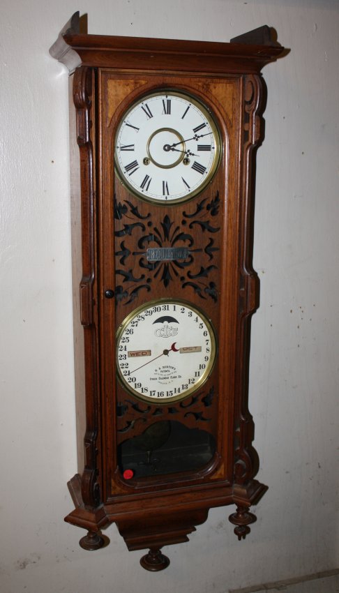 Ithaca Clock Co Calendar wall clock in oak case